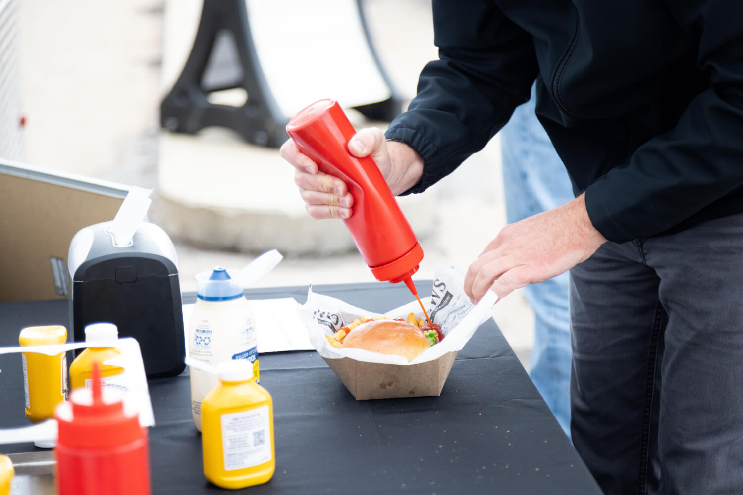 Customer,squirting,ketchup,on,his,french,fries